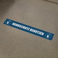 70 x 10 cm | Handschutz benutzen, Fußbodenaufkleber, 155g SK-Folie